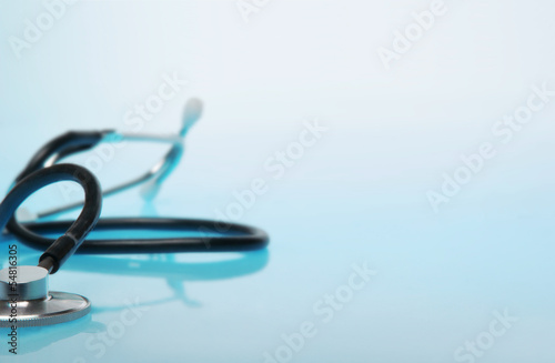 Stethoscope on blue background