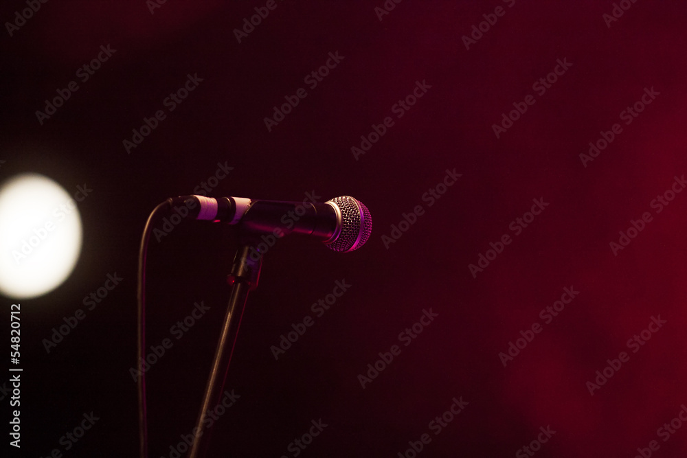 Obraz premium Microphone in stage lights