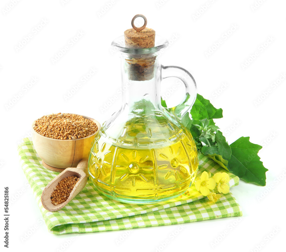 Jar of mustard oil and seeds with mustard flower Jar of mustard oil and seeds with mustard flower