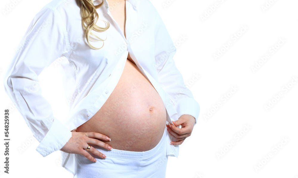 Image of pregnant woman touching her belly with hands