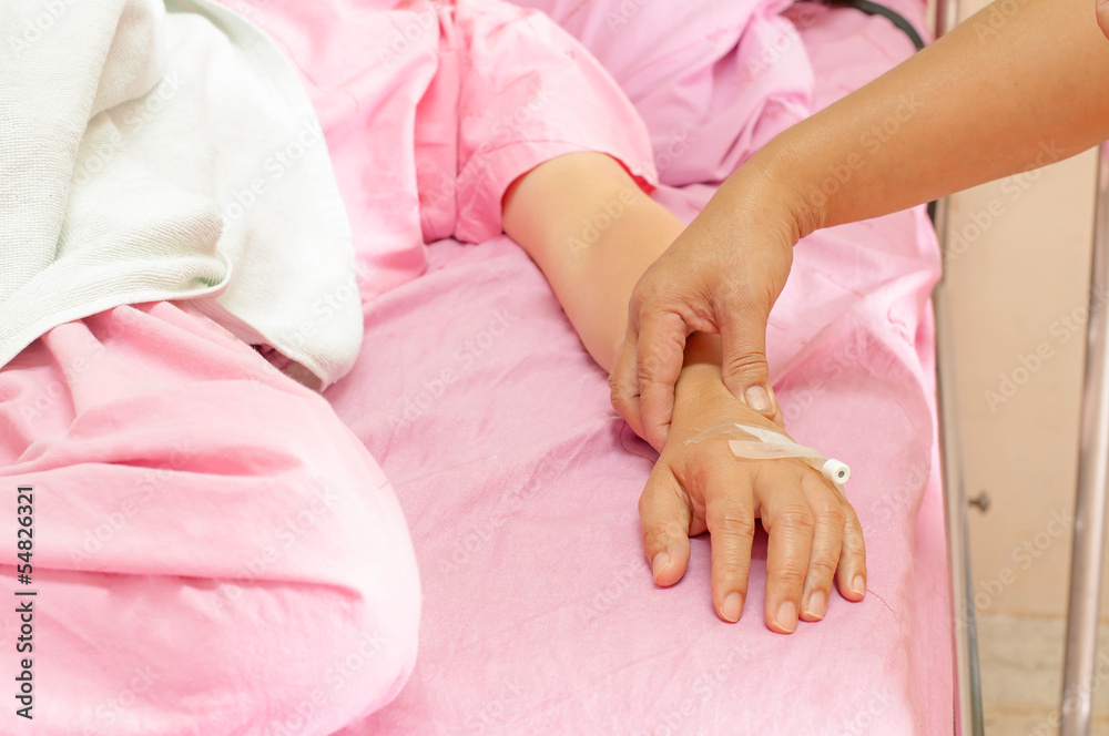 Closeup of female nurses pulse in the hands of patients Closeup of female nurses pulse in the hands of patients