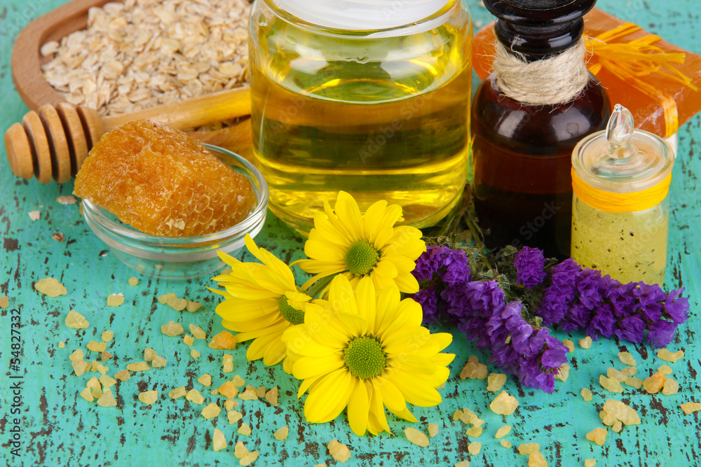 Fragrant honey spa with oils and honey on wooden table close-up Fragrant honey spa with oils and honey on wooden table close-up