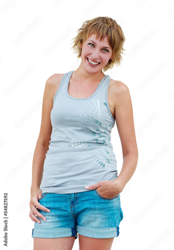 Fototapeta premium Casual woman smiling and puts hand inside pocket of denim jeans