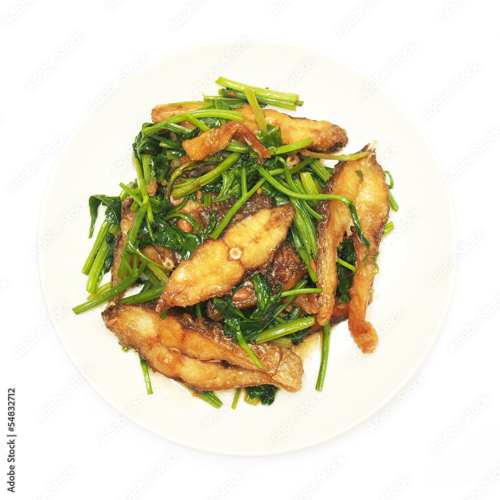 Fried crisp fish with coriander on plate Fried crisp fish with coriander on plate