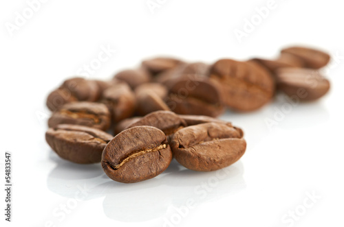 Macro of coffee beans isolated on white background