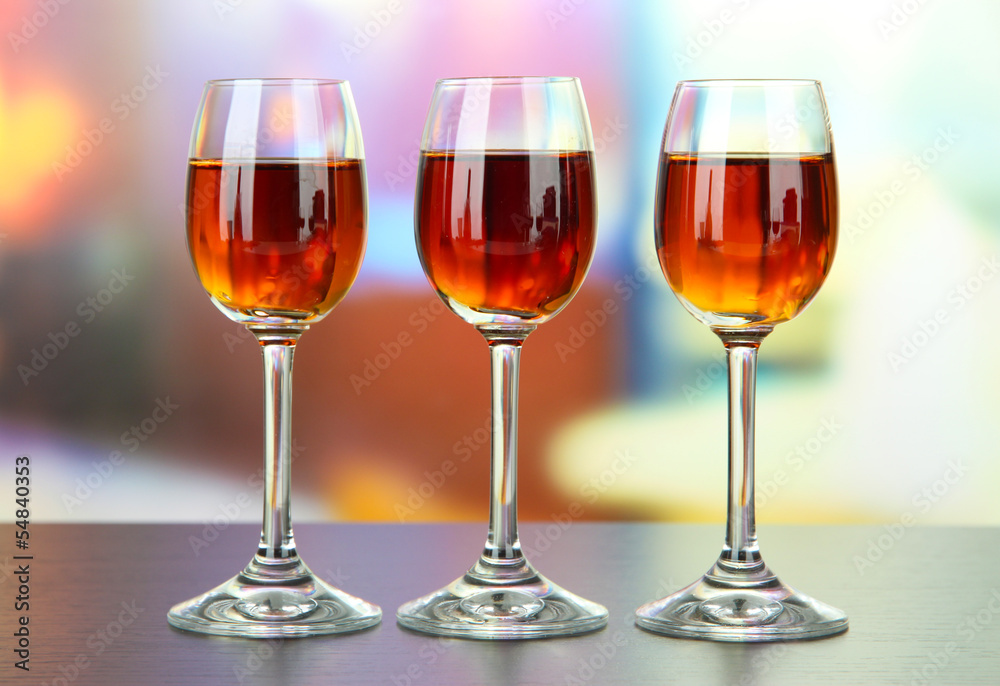 Glass of amaretto liquor, on bright background
