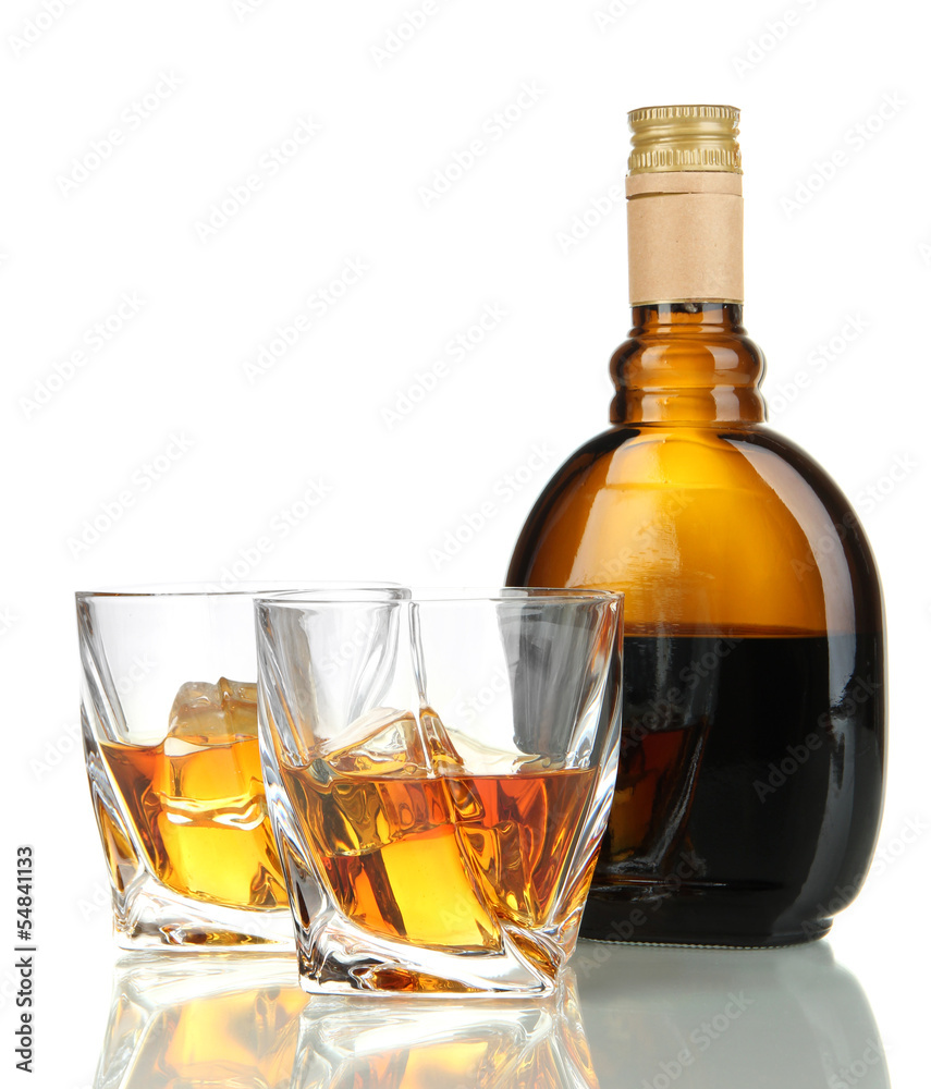 Glasses of whiskey with bottle, isolated on white Glasses of whiskey with bottle, isolated on white