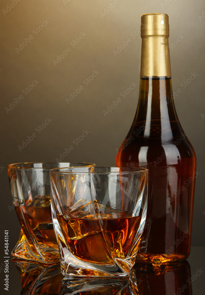 Glass of whiskey with bottle, on dark background Stock Photo | Adobe Stock