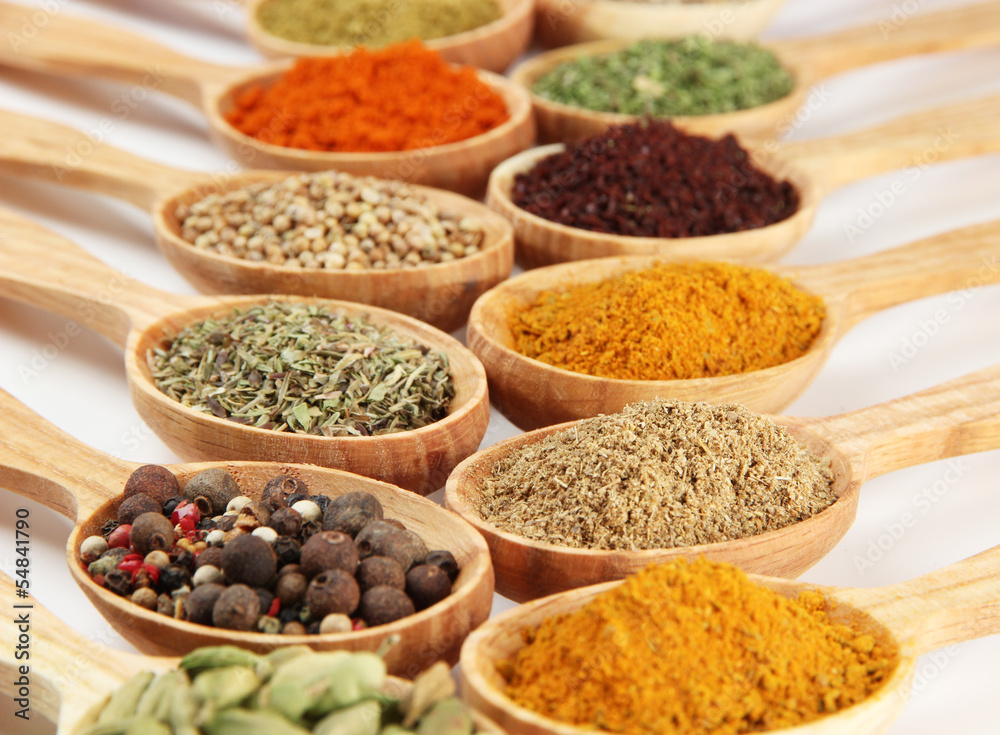 Assortment of spices in wooden spoons