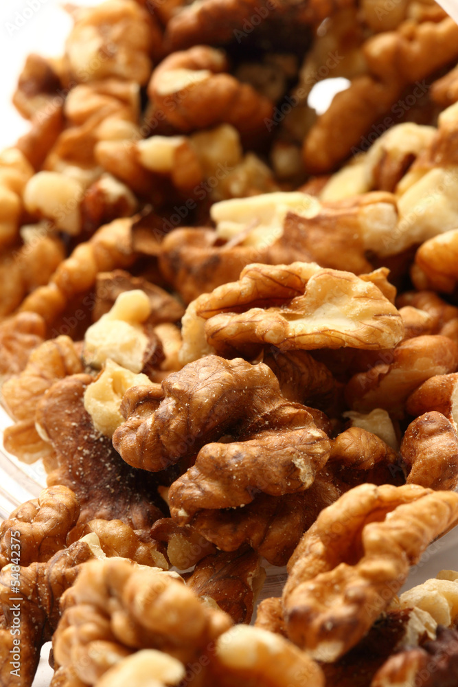 Heap of walnuts on white background