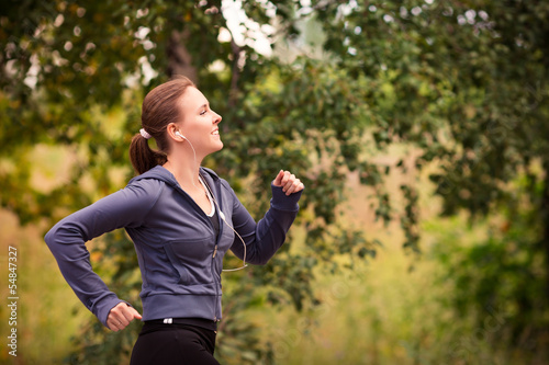 Runner woman jogging in nature outdoor