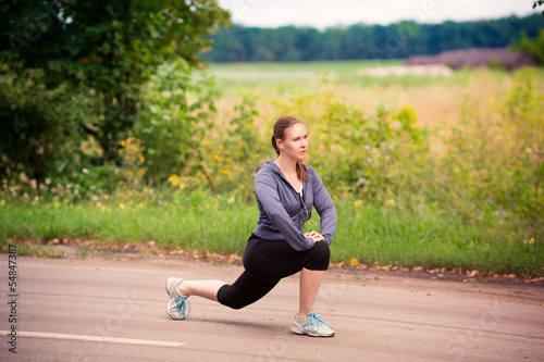 Runner woman stretching in nature outdoor © len44ik