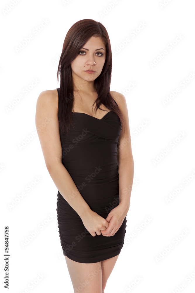 Young woman in a little black dress is sad. Young woman in a little black dress is sad.