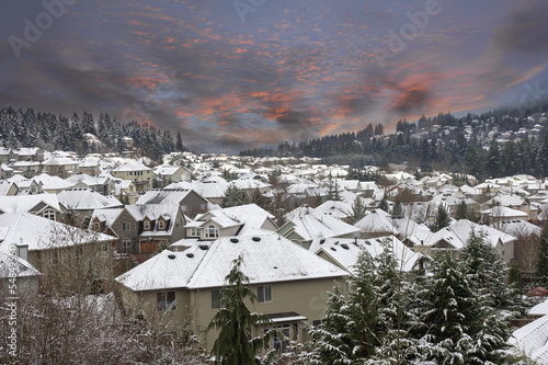 Winter Scene in Suburbs Neighborhhood with Sunset Sky photo