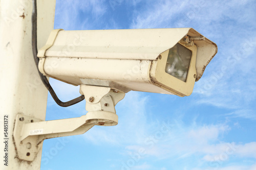 CCTV security camera with blue sky