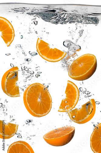 Healthy Water with Fresh Oranges. Splash isolated on white