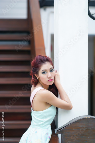 Beautiful young woman stand alone at the outdoor mall