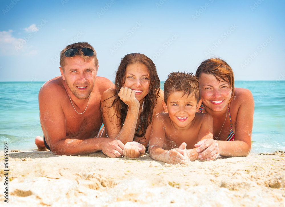 Happy Family Having Fun at the Beach. Summer Holidays Happy Family Having Fun at the Beach. Summer Holidays