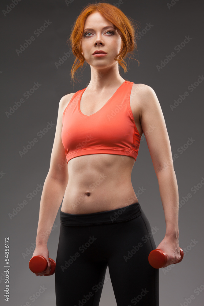 woman exercising with dumbbells