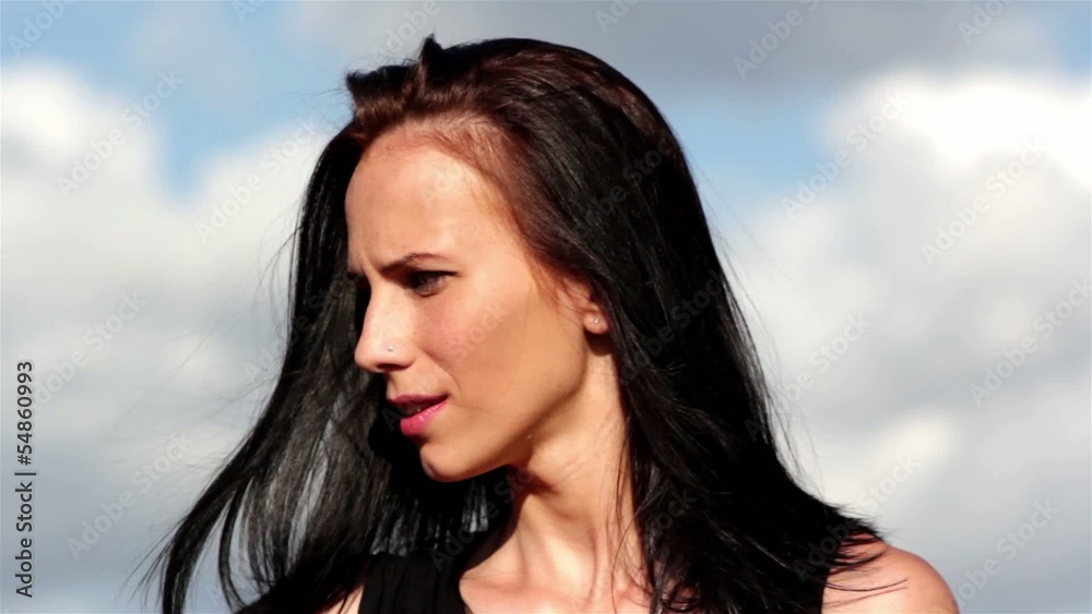 Portrait of young beautiful woman on the background of sky Portrait of young beautiful woman on the background of sky