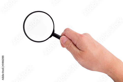 Hand holding magnifying glass