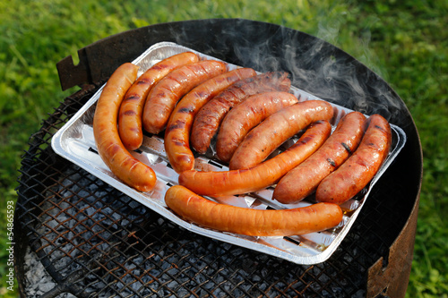 bbq grill with sausages on the grill