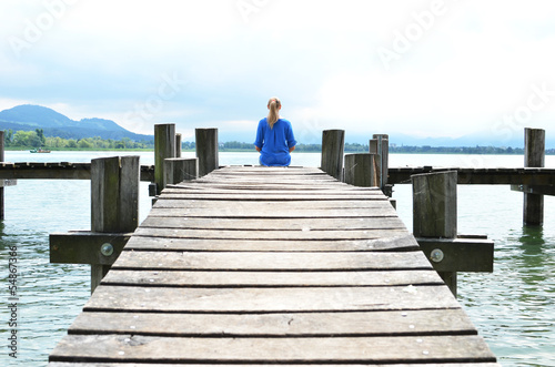 Girl on the wooden jetty