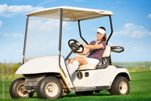 Woman in golf cart