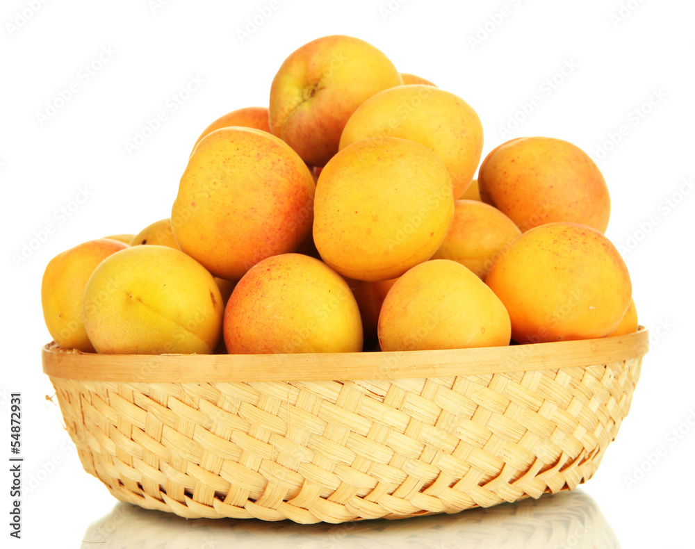 Fresh natural apricot in wicker basket isolated on white Fresh natural apricot in wicker basket isolated on white
