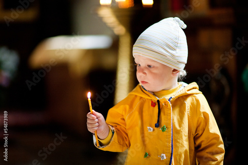 child with candle