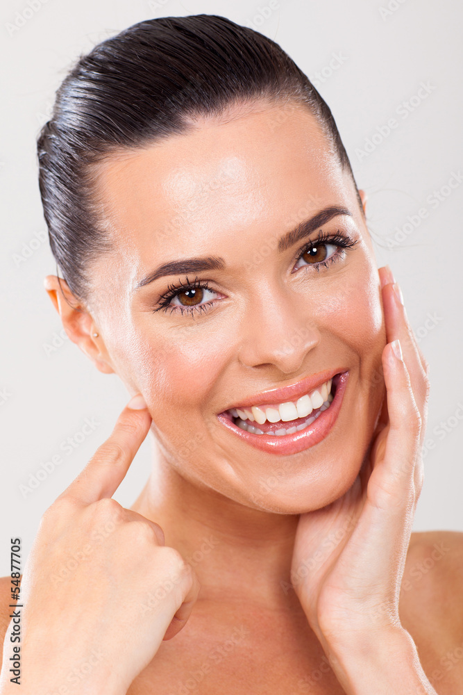 woman touching healthy face skin