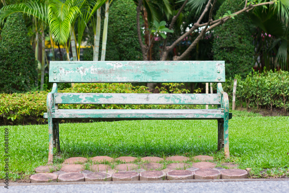 Old green bench in the gardent Old green bench in the gardent
