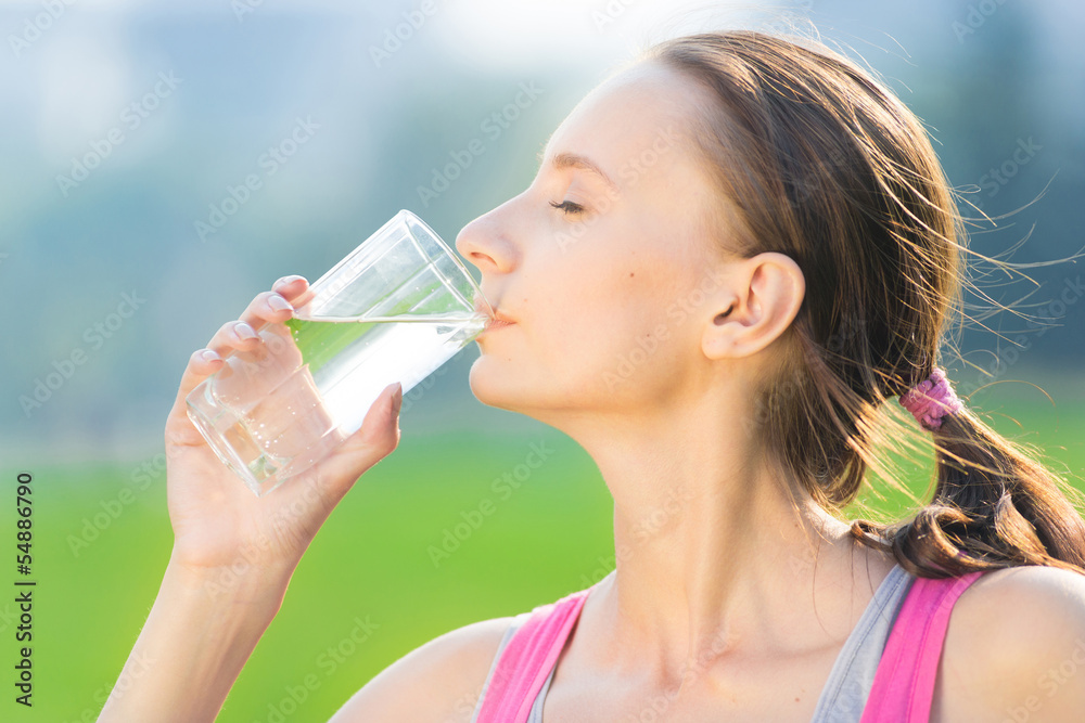 Portrait of woman drinking water after sport Portrait of woman drinking water after sport