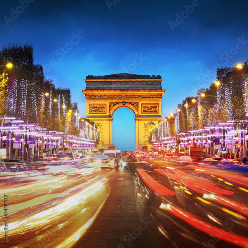 Arc de triomphe Paris city at sunset - Arch of Triumph and Champ © dell