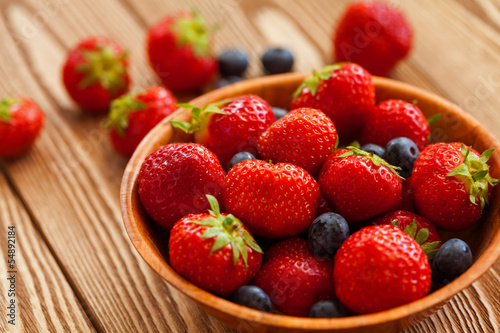 Berries on Wooden Background.