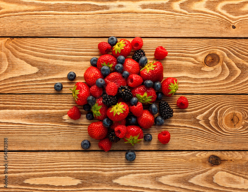 Berries on Wooden Background.