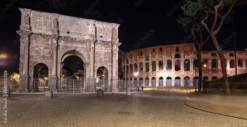 night view of The Colosseum and The Arch of Constantine in Rome