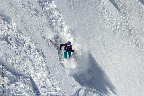 Woman Snow Skier on a dangerous, steep slope