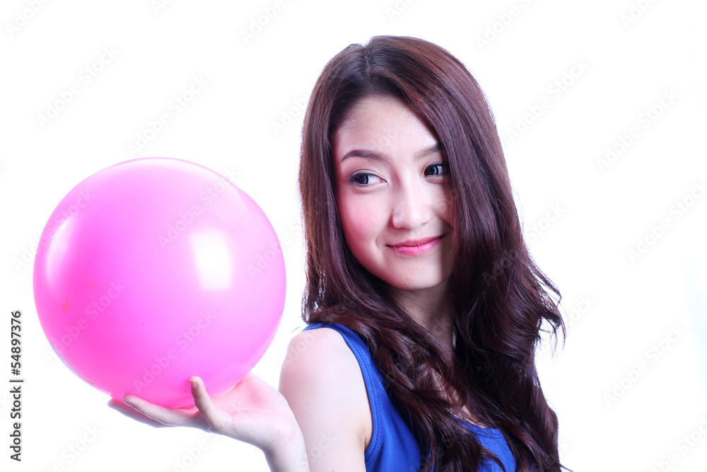 Asian woman playing pink ball on white background Asian woman playing pink ball on white background