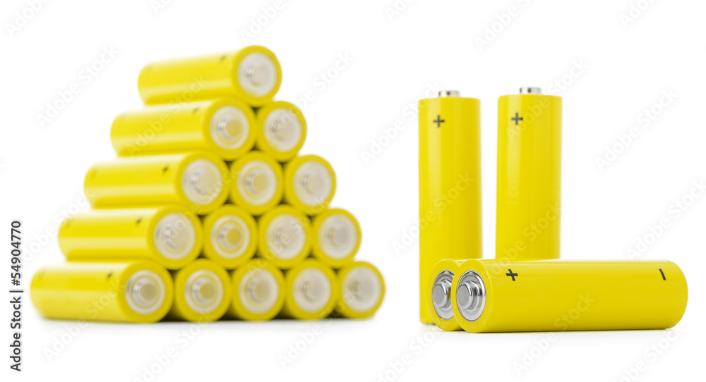 Stack of yellow batteries isolated on white background Stack of yellow batteries isolated on white background