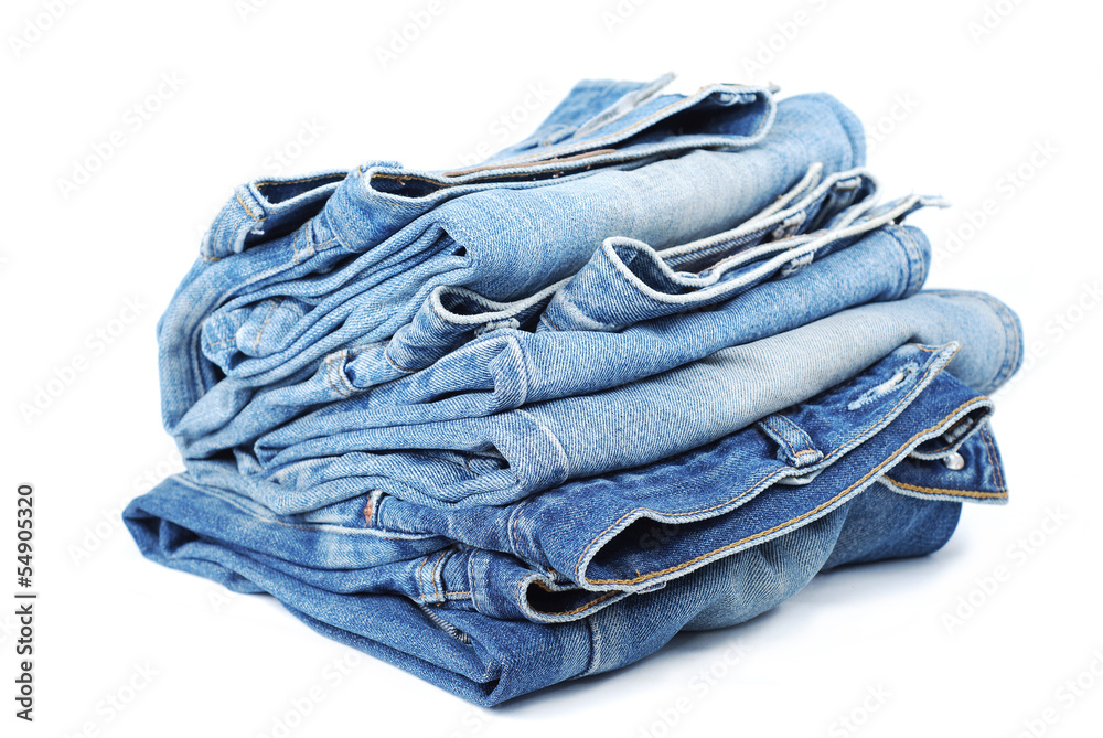 Stack of blue jeans on white background Stack of blue jeans on white background