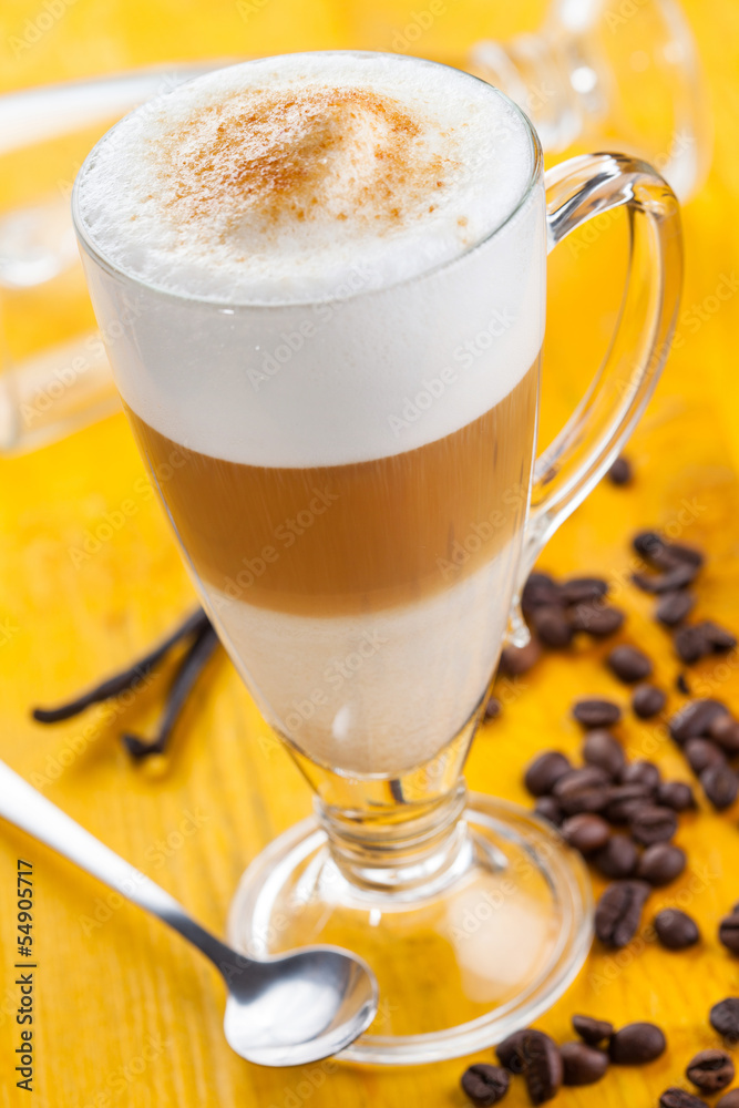 Coffee latte on yellow background Coffee latte on yellow background
