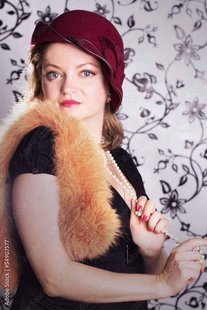 Retro woman in hat over glamorous background Retro woman in hat over glamorous background