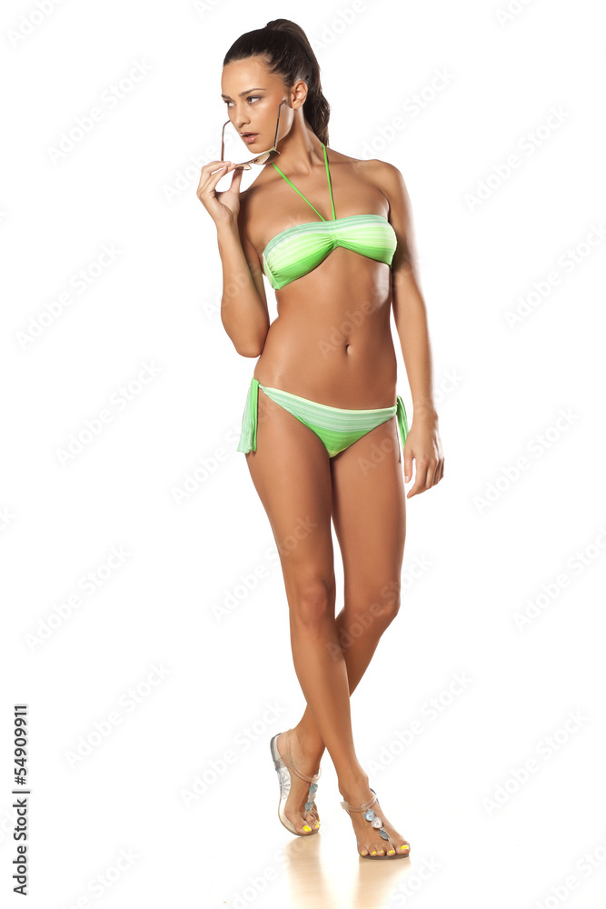 pretty and beautiful young brunette posing in a bikini pretty and beautiful young brunette posing in a bikini