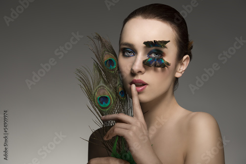 sensual woman with peacock feathers