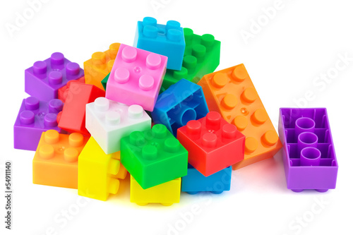 Toy colorful plastic blocks on white background