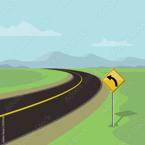 left curve road and left turn road sign, on green landscape