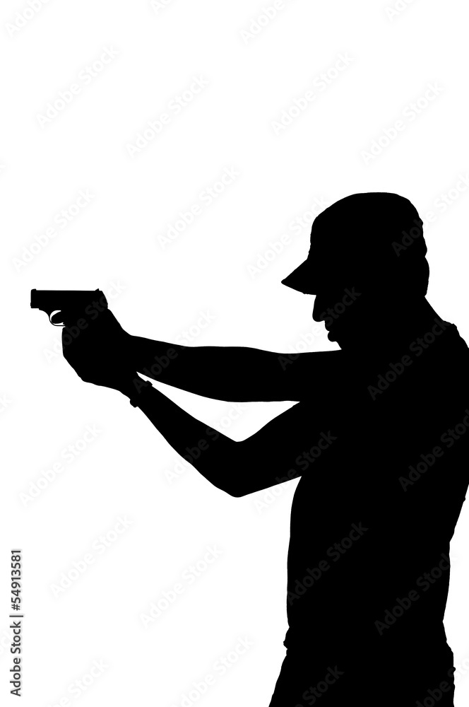 silhouette of a young male pointing gun.