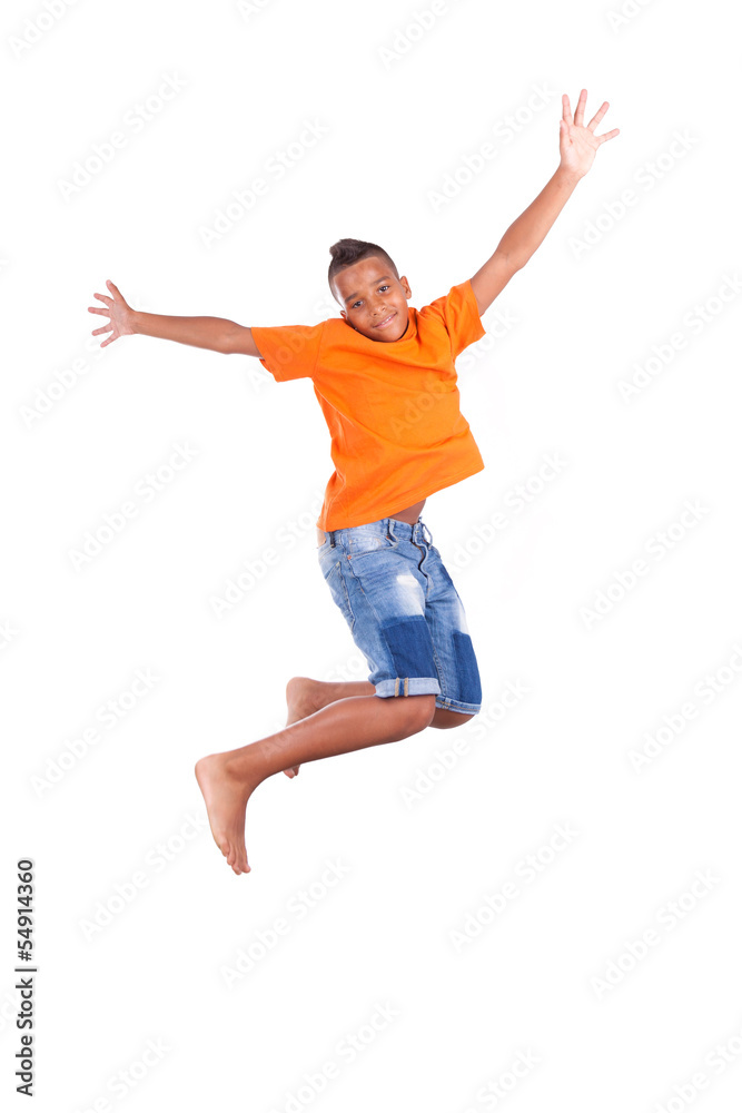 Portrait of a cute teenage black boy jumping over white backgrou