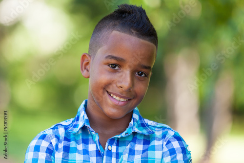 Outdoor portrait of a cute teenage black boy - African people